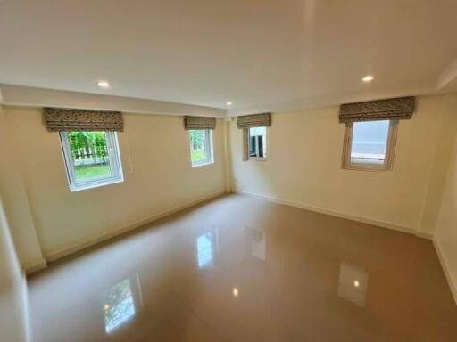 Spacious empty bedroom with windows