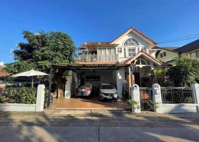 Exterior view of a residential property with a carport