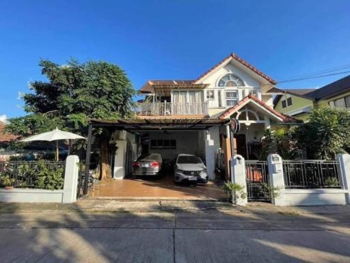 Exterior view of a residential property with a carport