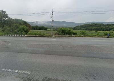 View of a road with distant hills and greenery