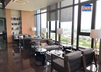 Modern living room with large windows and city view