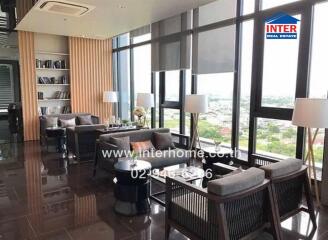 Modern living room with large windows and city view