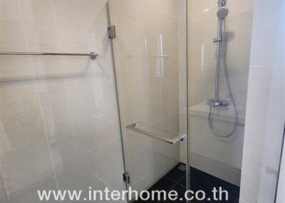 Modern bathroom with glass-enclosed shower