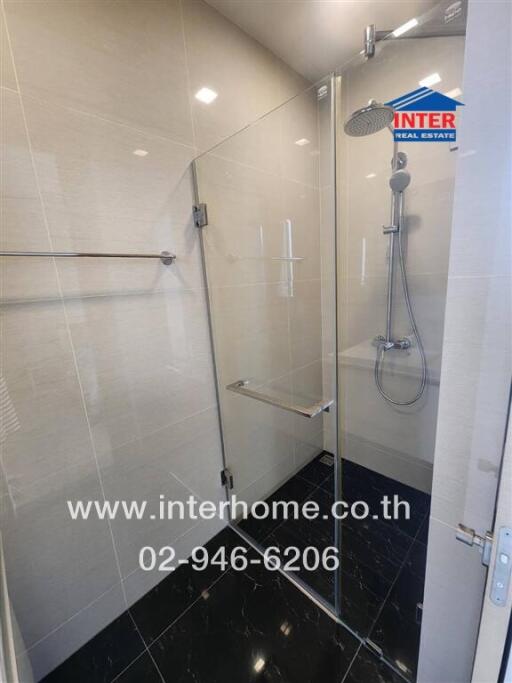 Modern bathroom with glass-enclosed shower