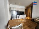 Modern kitchen and dining area with wooden flooring