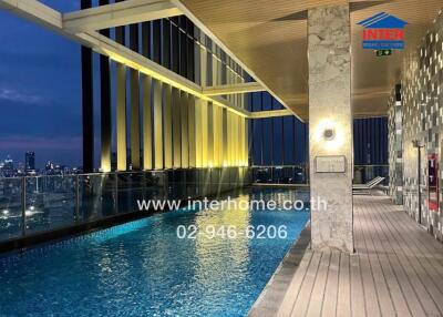 Rooftop Pool with City View at Night