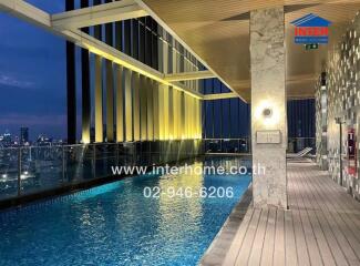 Rooftop Pool with City View at Night