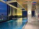 Rooftop Pool with City View at Night
