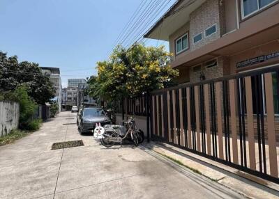 Street view in front of the property showing the building and surroundings