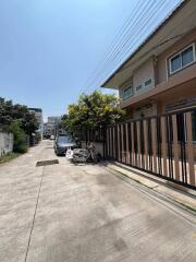 Street view in front of the property showing the building and surroundings