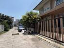 Street view in front of the property showing the building and surroundings