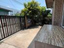 Well-maintained front yard with paved area and greenery