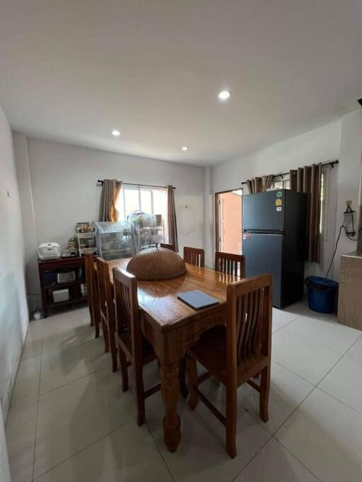 Dining area with wooden table and chairs