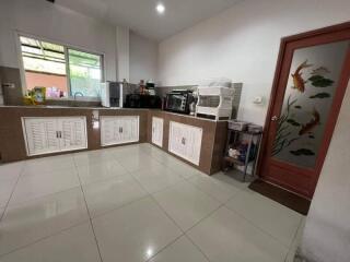 Modern kitchen with white cabinets and appliances