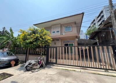 Two-story house with a gated front yard