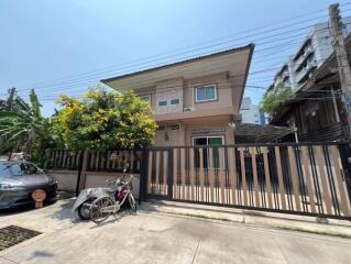 Two-story house with a gated front yard