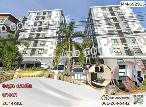 A modern condominium complex with palm trees and ample parking.