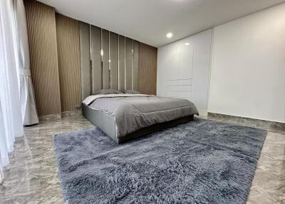 Modern bedroom with minimalist decor and large bed