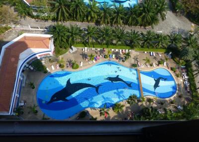 Aerial view of a landscaped outdoor pool with dolphin designs