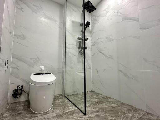 Modern bathroom with glass shower and toilet