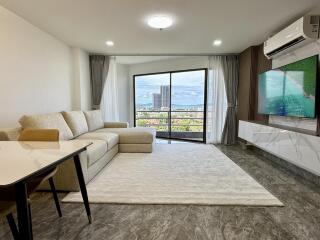 Modern living room with large windows and a view