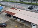 Covered parking area with vehicles