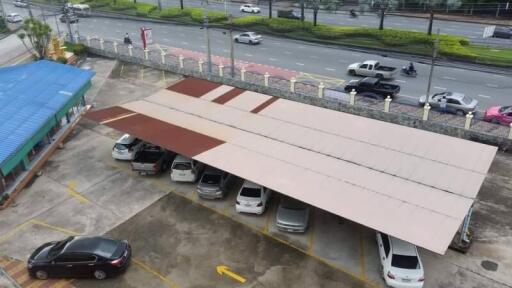 Covered parking area with vehicles