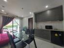 Modern kitchen with dining area and view to outside