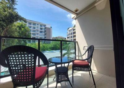 Cozy apartment balcony with outdoor furniture and scenic view