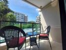 Cozy apartment balcony with outdoor furniture and scenic view