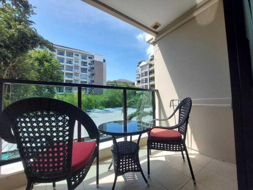 Cozy apartment balcony with outdoor furniture and scenic view