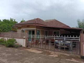 Single-story house with gated driveway