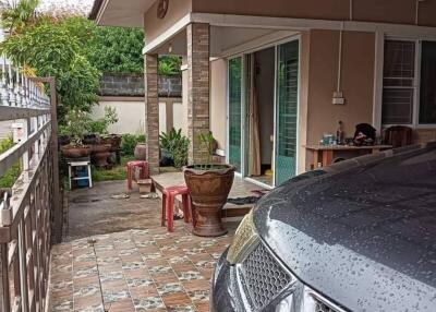 Exterior view of a house with a car parked in the driveway