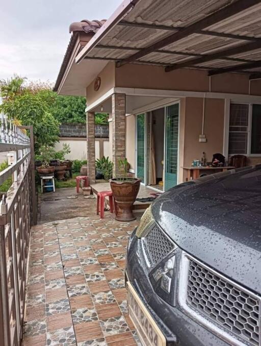 Exterior view of a house with a car parked in the driveway