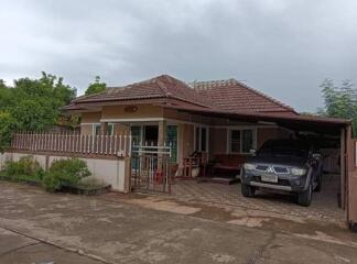 Single-story house with front yard and carport