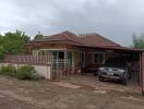 Single-story house with front yard and carport