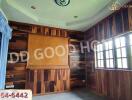 Bedroom with wooden paneling and large window