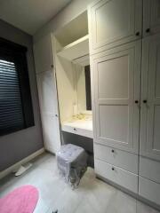 Bedroom with built-in wardrobe and vanity area