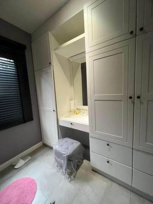 Bedroom with built-in wardrobe and vanity area