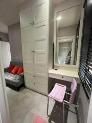 Bedroom with wardrobe and vanity