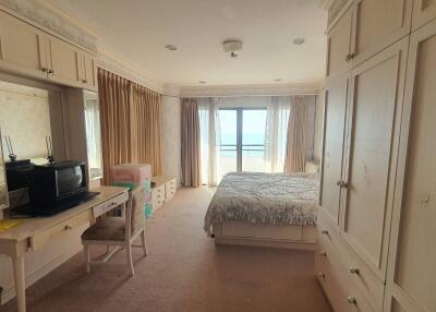 Spacious bedroom with balcony and ocean view