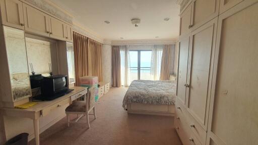 Spacious bedroom with balcony and ocean view