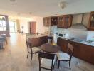 Modern kitchen and dining area with a view of the living room