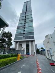 Modern high-rise apartment building with security gate