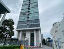 Modern high-rise apartment building with security gate