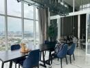 Modern dining area with large windows and city view