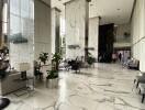 Modern building lobby with high ceilings and marble flooring