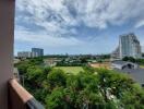 Scenic balcony view with lush greenery and city skyline