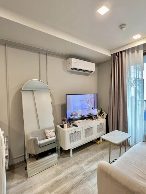 Modern living room with TV and air conditioner