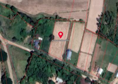 Aerial view of a land plot highlighted on a map